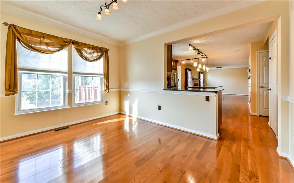 102 Ridgeview Circle Glenshaw, PA 15116 - Photo 6 of 25 Gleaming hardwood flooring graces the dining room, kitchen, and family room