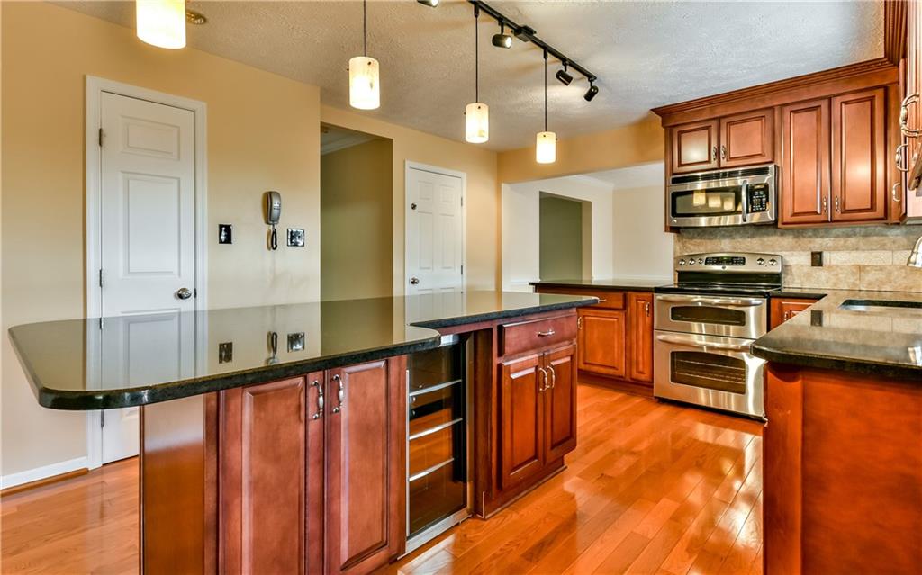 102 Ridgeview Circle Glenshaw, PA 15116 - Photo 8 of 25 Gorgeous center island with granite counters and a beverage center. Newer stainless steel appliances all included!