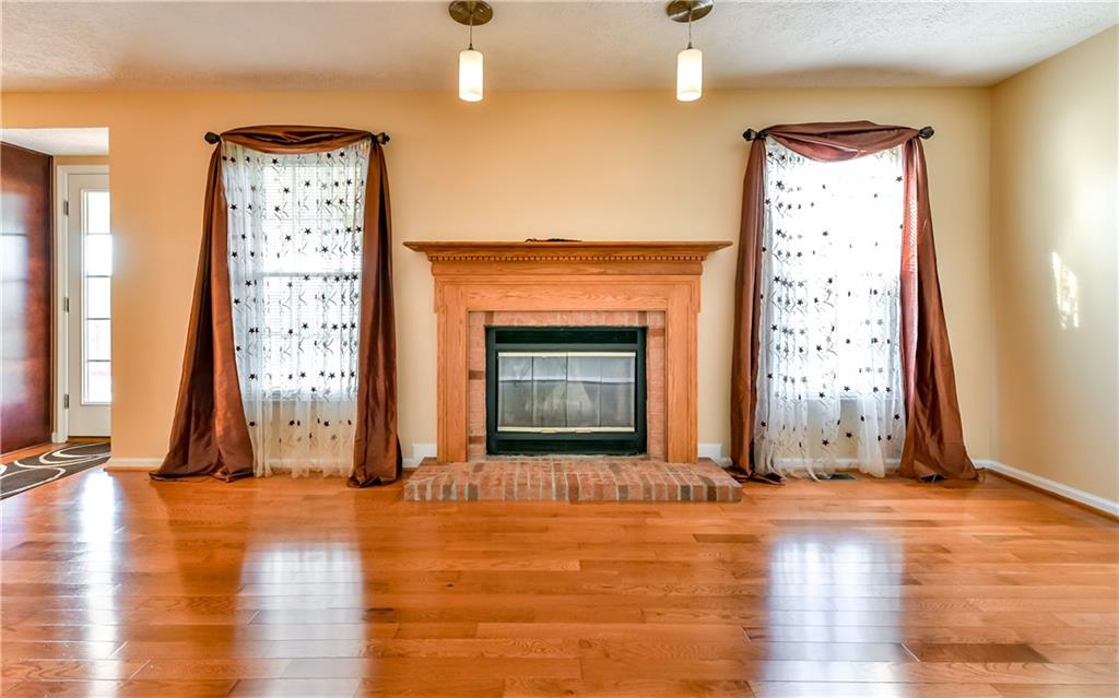 102 Ridgeview Circle Glenshaw, PA 15116 - Photo 10 of 25 Cozy family room with log burning fireplace. Door to the left leads to the covered rear deck