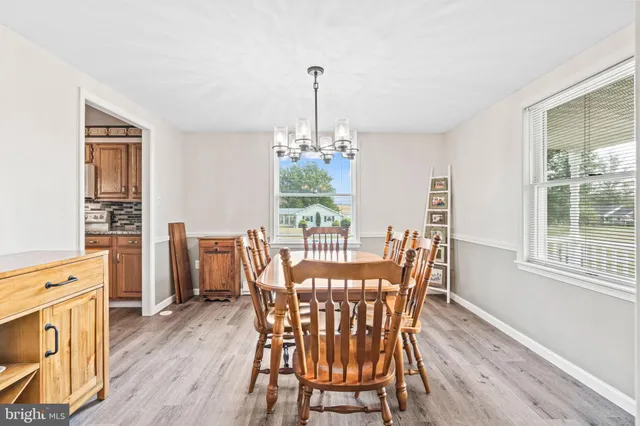 a dining room with furniture window wooden floor