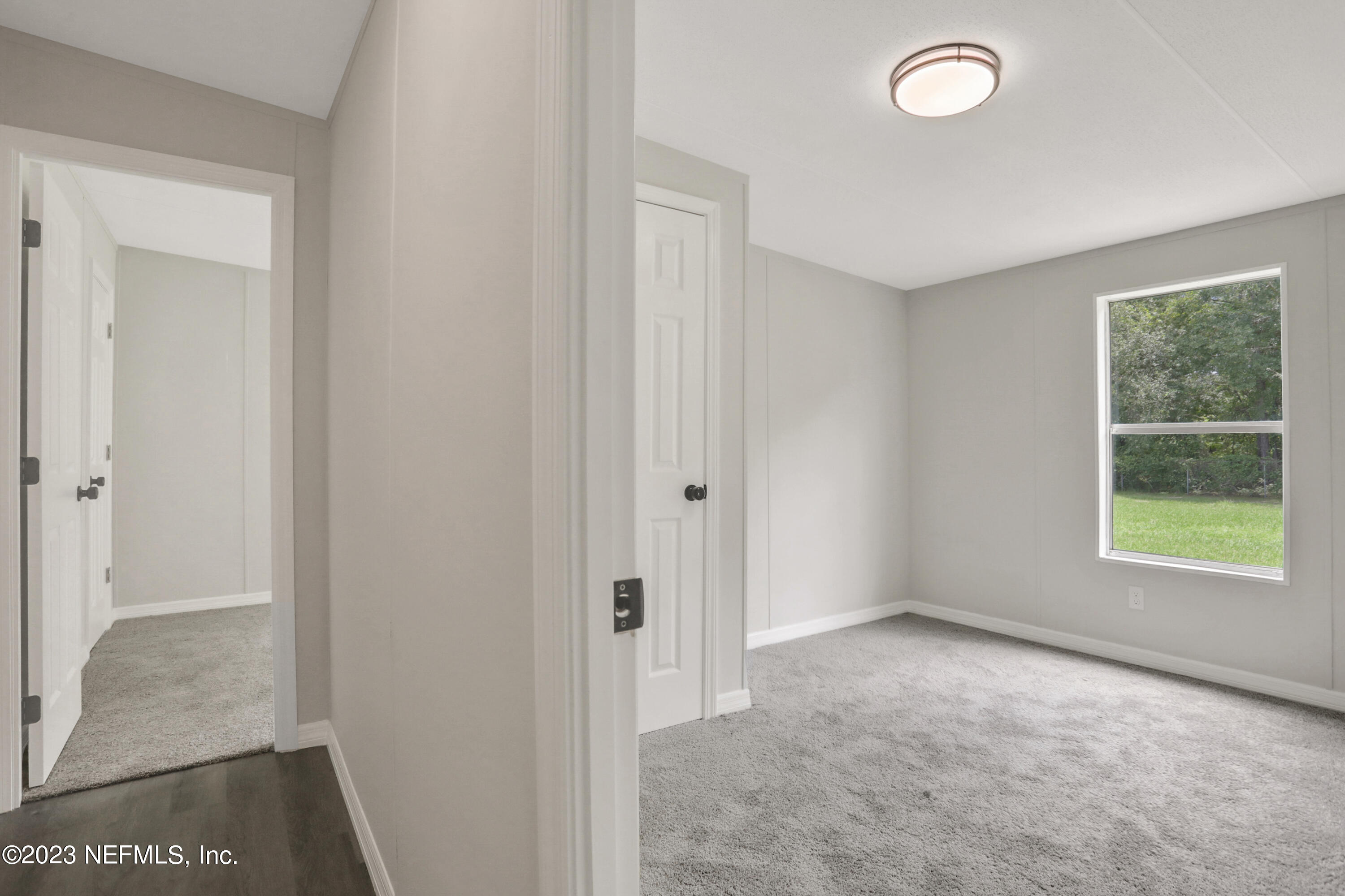 10765 Boddens Road Jacksonville, FL 32219 - Photo 15 of 39 a view of an empty room with a window