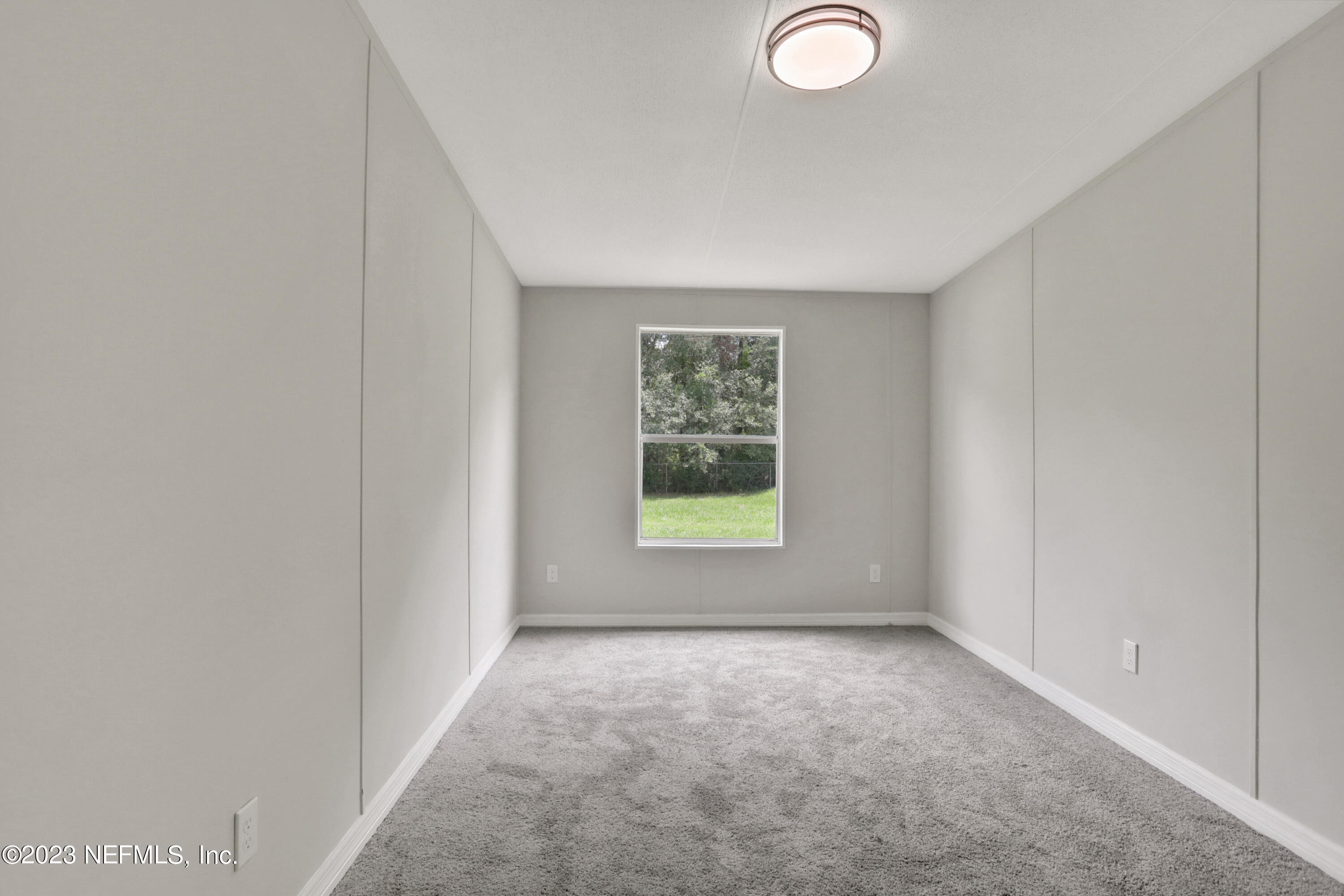 10765 Boddens Road Jacksonville, FL 32219 - Photo 17 of 39 an empty room with a window