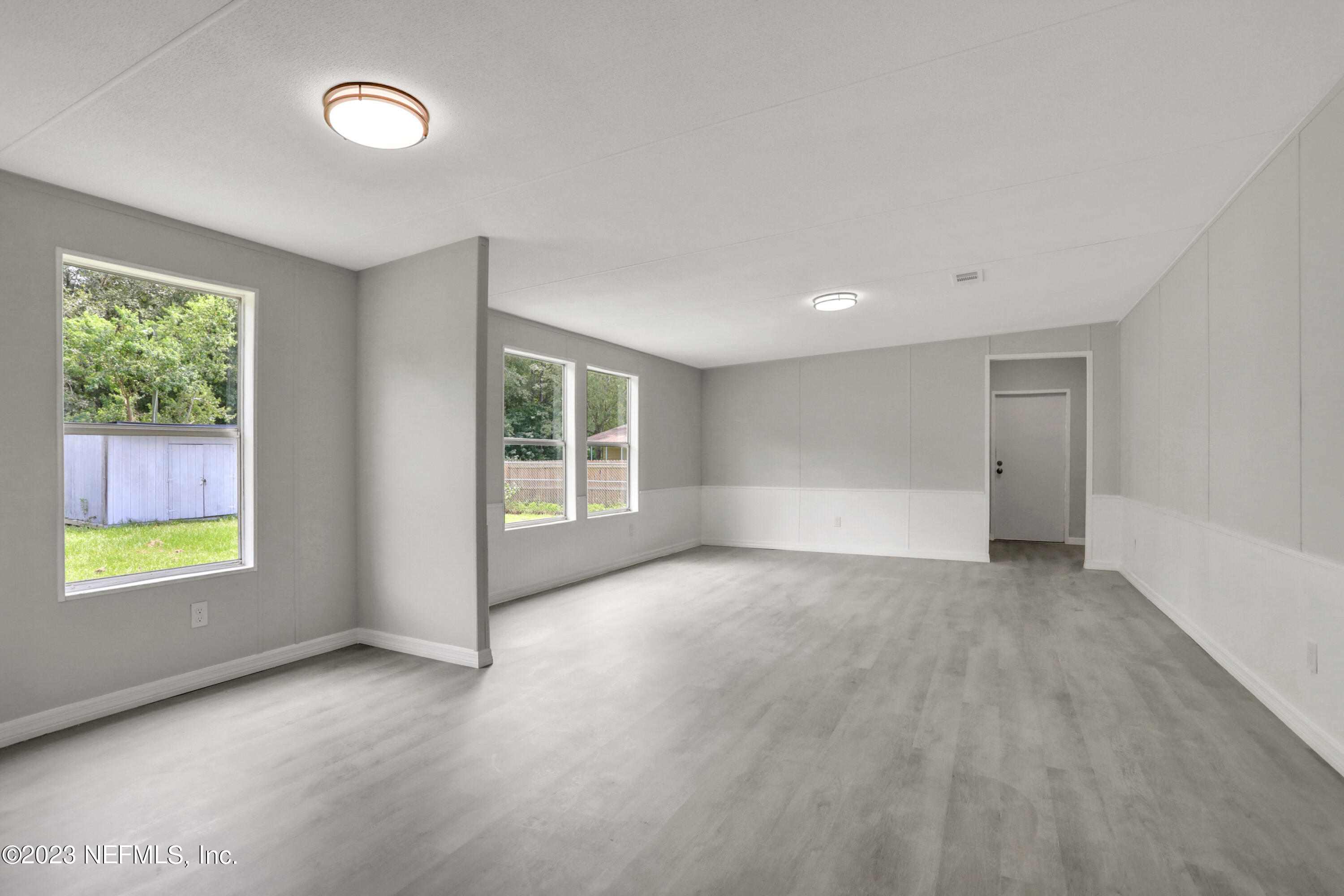 10765 Boddens Road Jacksonville, FL 32219 - Photo 22 of 39 an empty room with windows