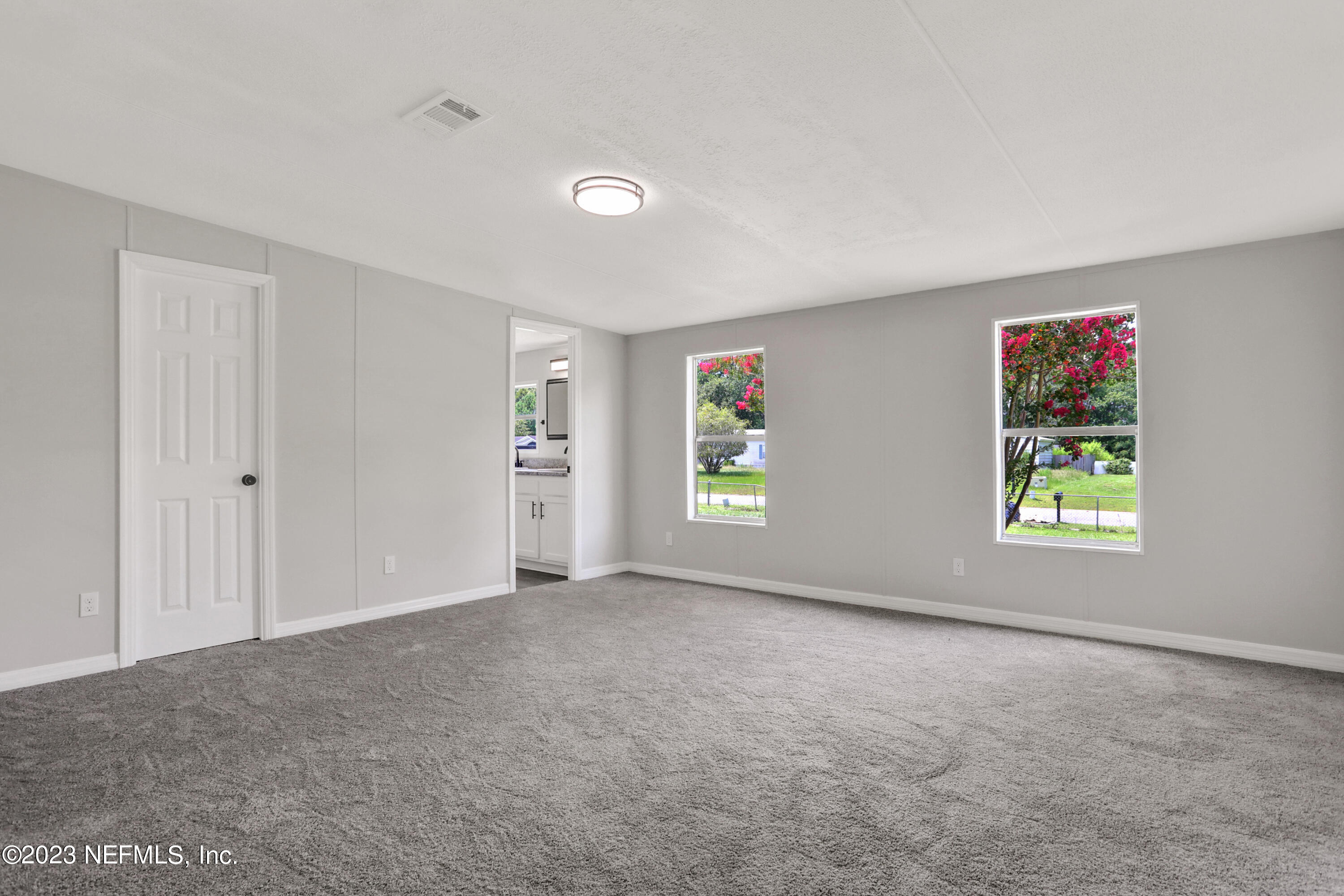 10765 Boddens Road Jacksonville, FL 32219 - Photo 25 of 39 a view of an empty room with a window