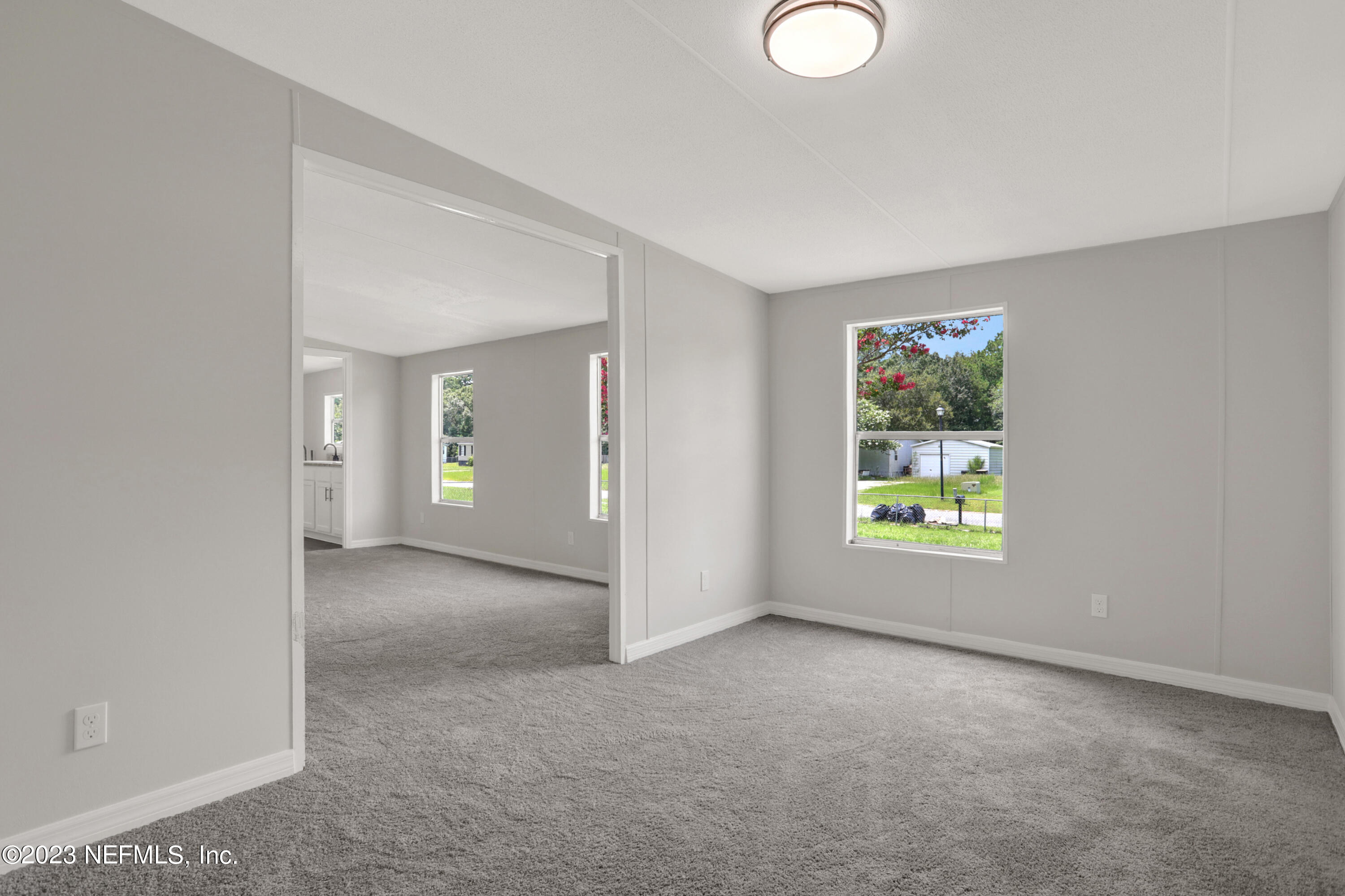 10765 Boddens Road Jacksonville, FL 32219 - Photo 28 of 39 an empty room with windows and closet