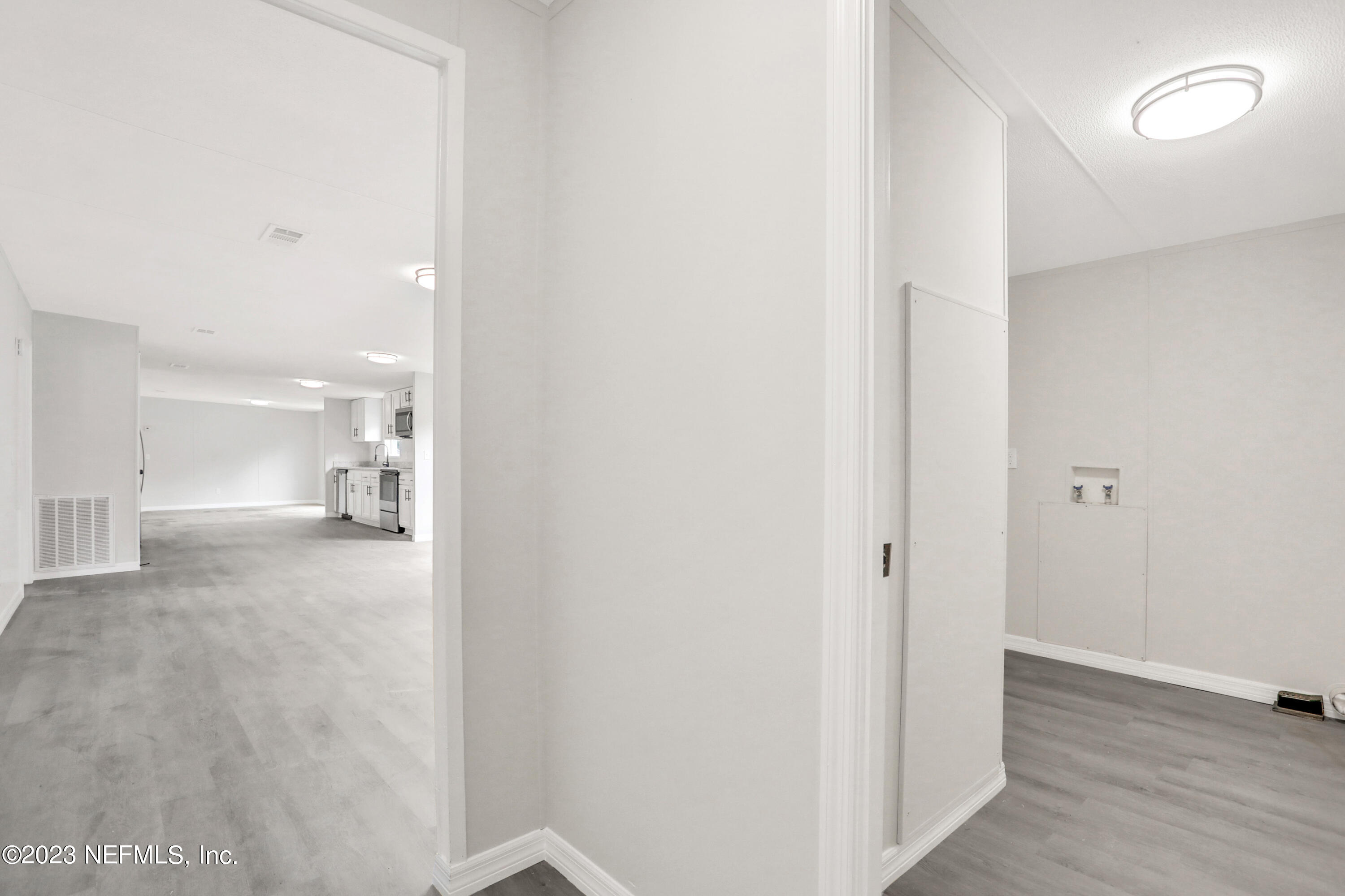 10765 Boddens Road Jacksonville, FL 32219 - Photo 34 of 39 a view of a hallway with wooden floor