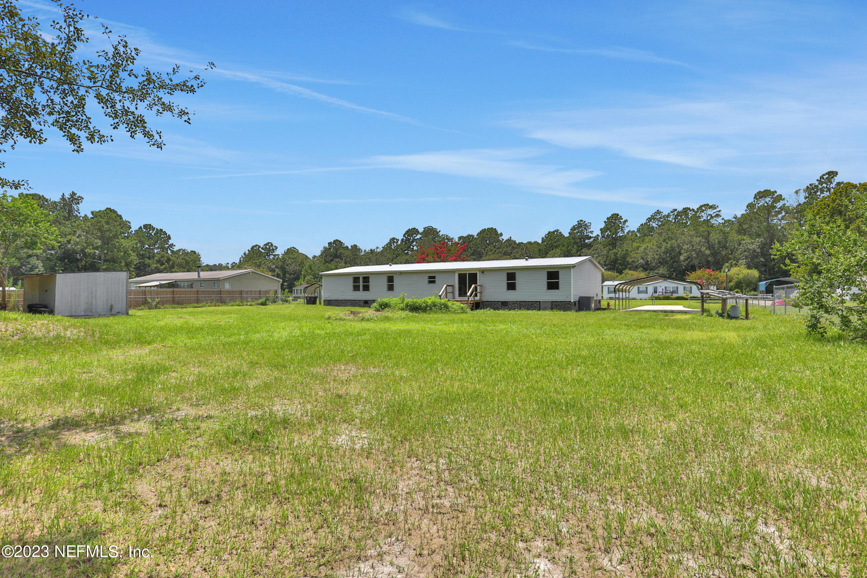 10765 Boddens Road Jacksonville, FL 32219 - Photo 39 of 39 a view of a house with a big yard