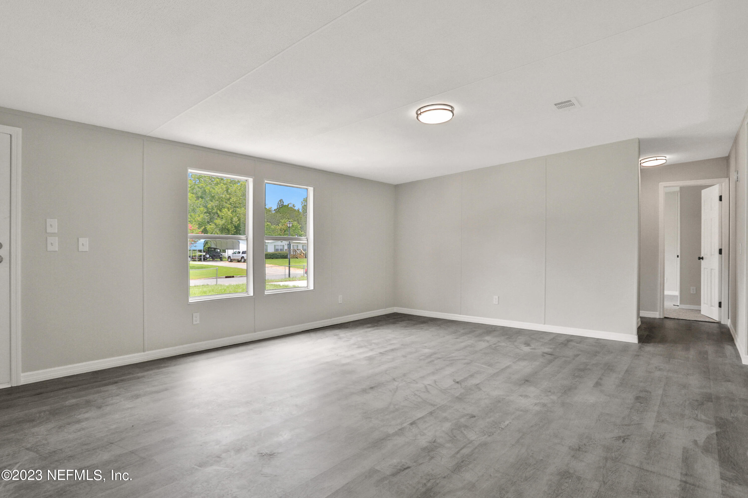 10765 Boddens Road Jacksonville, FL 32219 - Photo 6 of 39 an empty room with windows