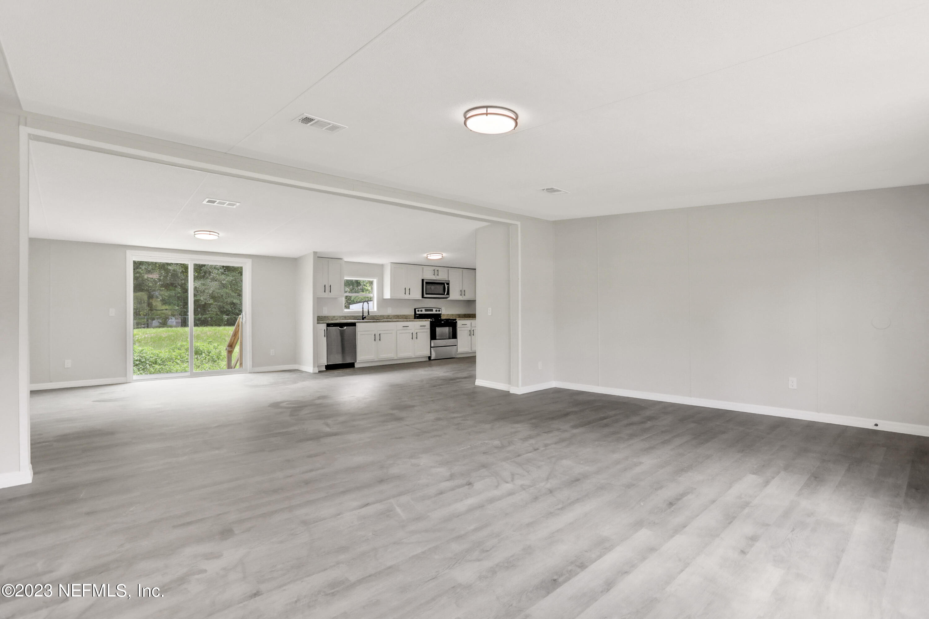 10765 Boddens Road Jacksonville, FL 32219 - Photo 7 of 39 a view of a kitchen with a sink and a window