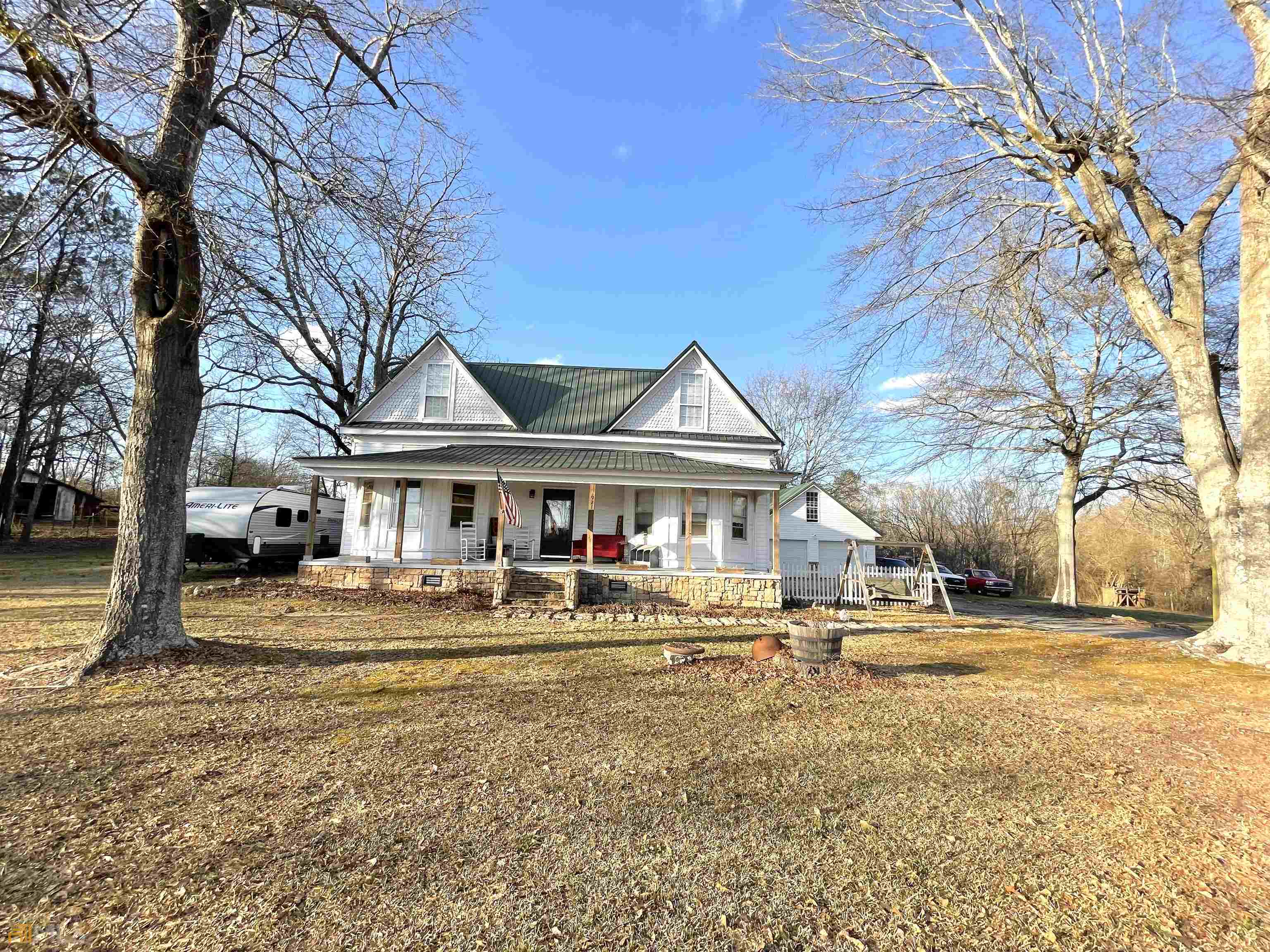 921 Sandy Flat Road Bowdon, GA 30108 - Photo 1 of 1 a front view of a building with street view