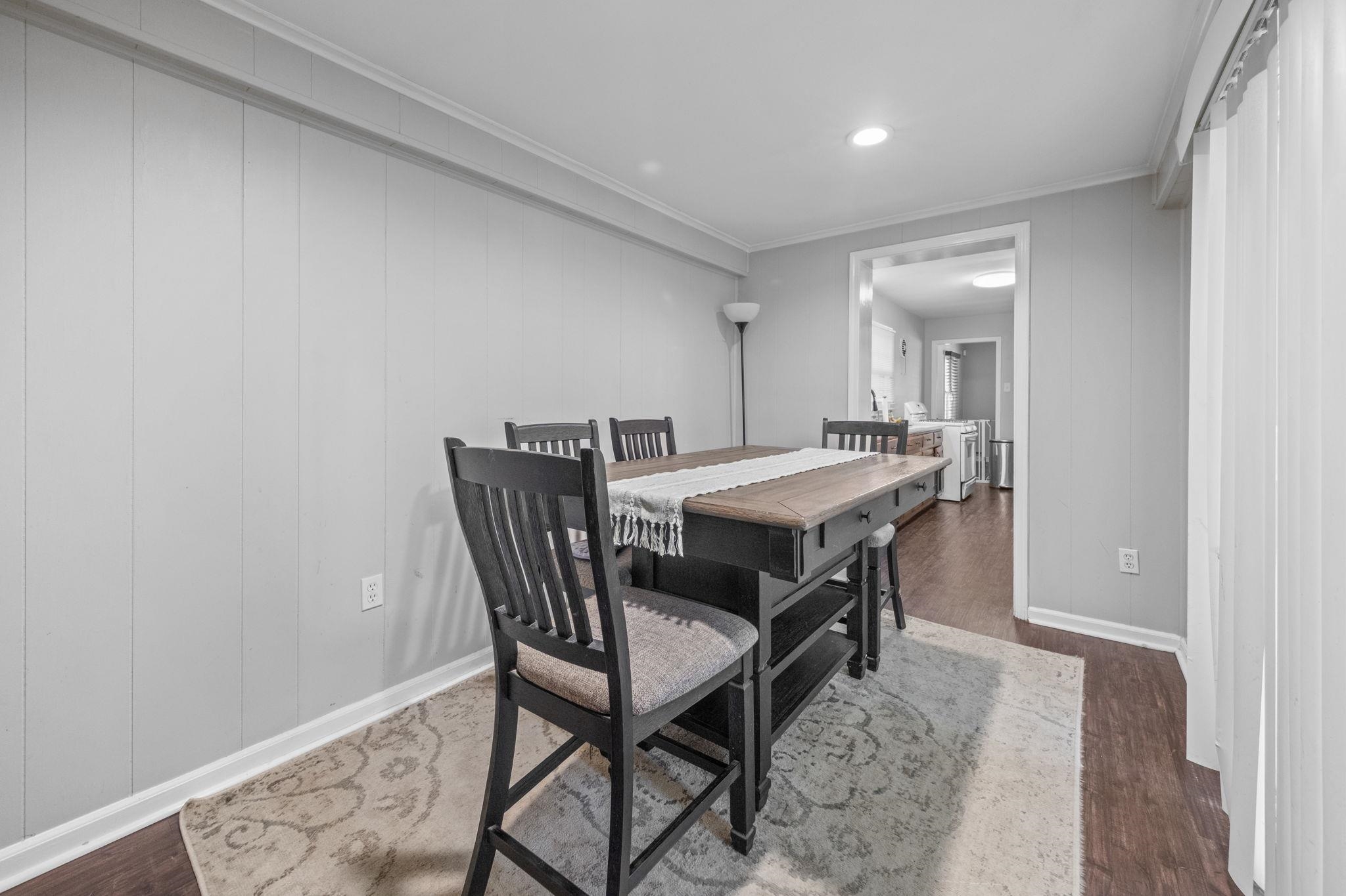 1435 Flamingo Road Memphis, TN 38117 - Photo 11 of 29 a dining room with a wooden table and chairs