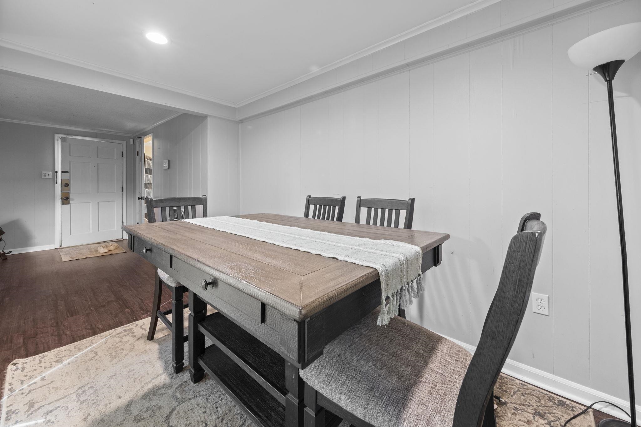 1435 Flamingo Road Memphis, TN 38117 - Photo 12 of 29 a dining room with a table and chairs