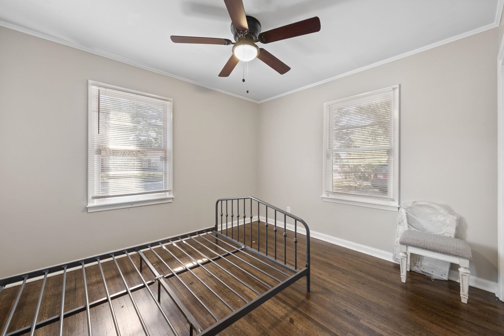 1435 Flamingo Road Memphis, TN 38117 - Photo 16 of 29 a view of an empty room with wooden floor and a window