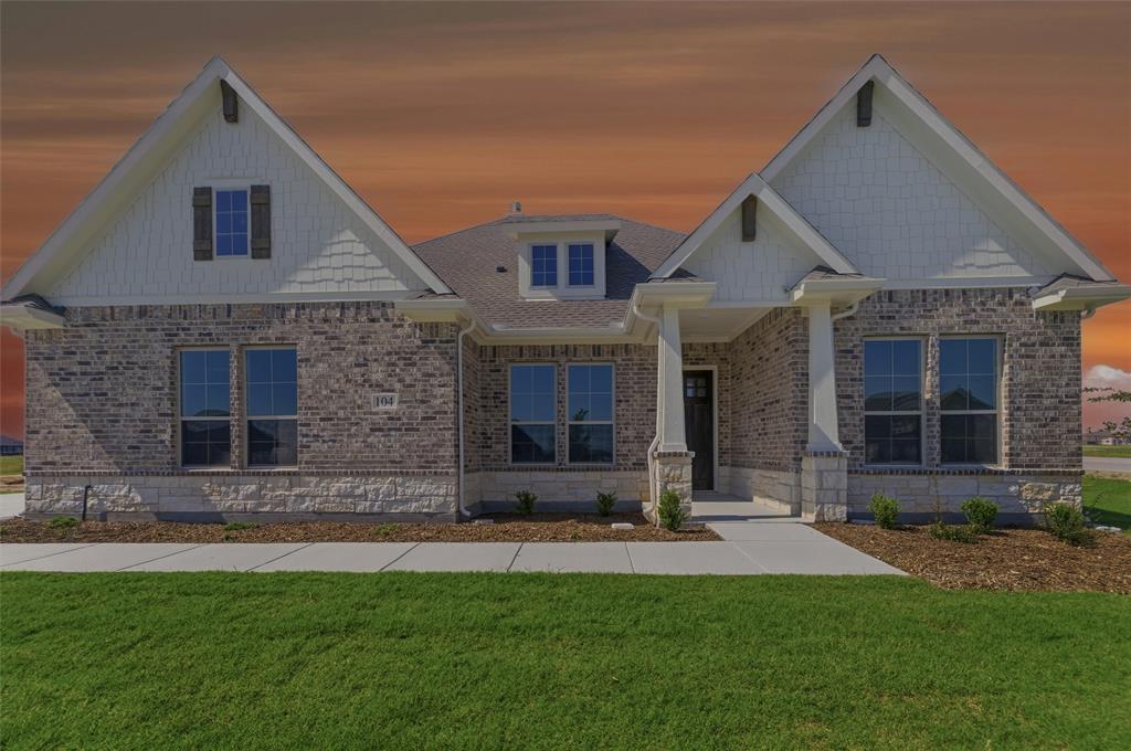 104 Snowy Owl Trail Rhome, TX 76078 - Photo 1 of 27 Brick and stone facade residence featuring a covered entry