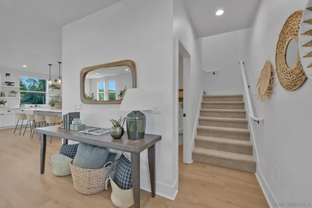 wooden floor in a room with a bathroom
