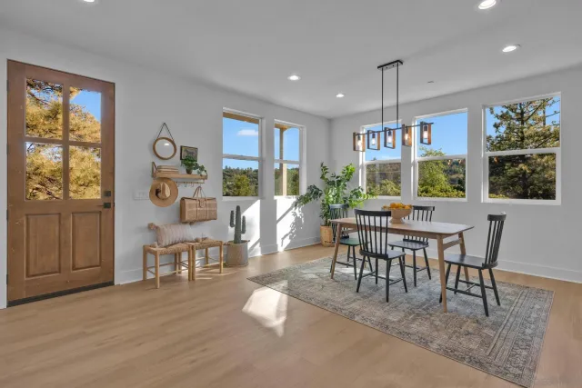 a view of a balcony with wooden floor and fence