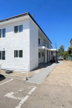 a front view of a house with a garage