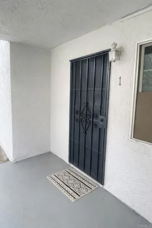 a view of a closet area with wooden floor