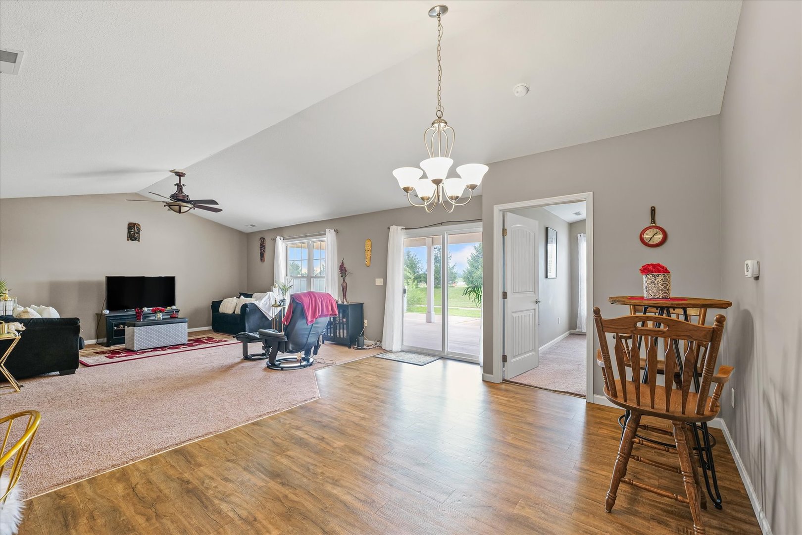 634 Sedgegrass Drive Champaign, IL 61822 - Photo 12 of 35 a living room with furniture and a chandelier