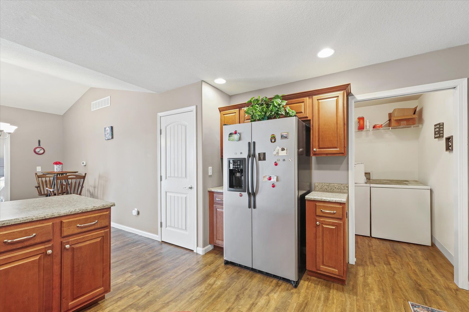 634 Sedgegrass Drive Champaign, IL 61822 - Photo 17 of 35 a kitchen with stainless steel appliances a refrigerator and wooden floor