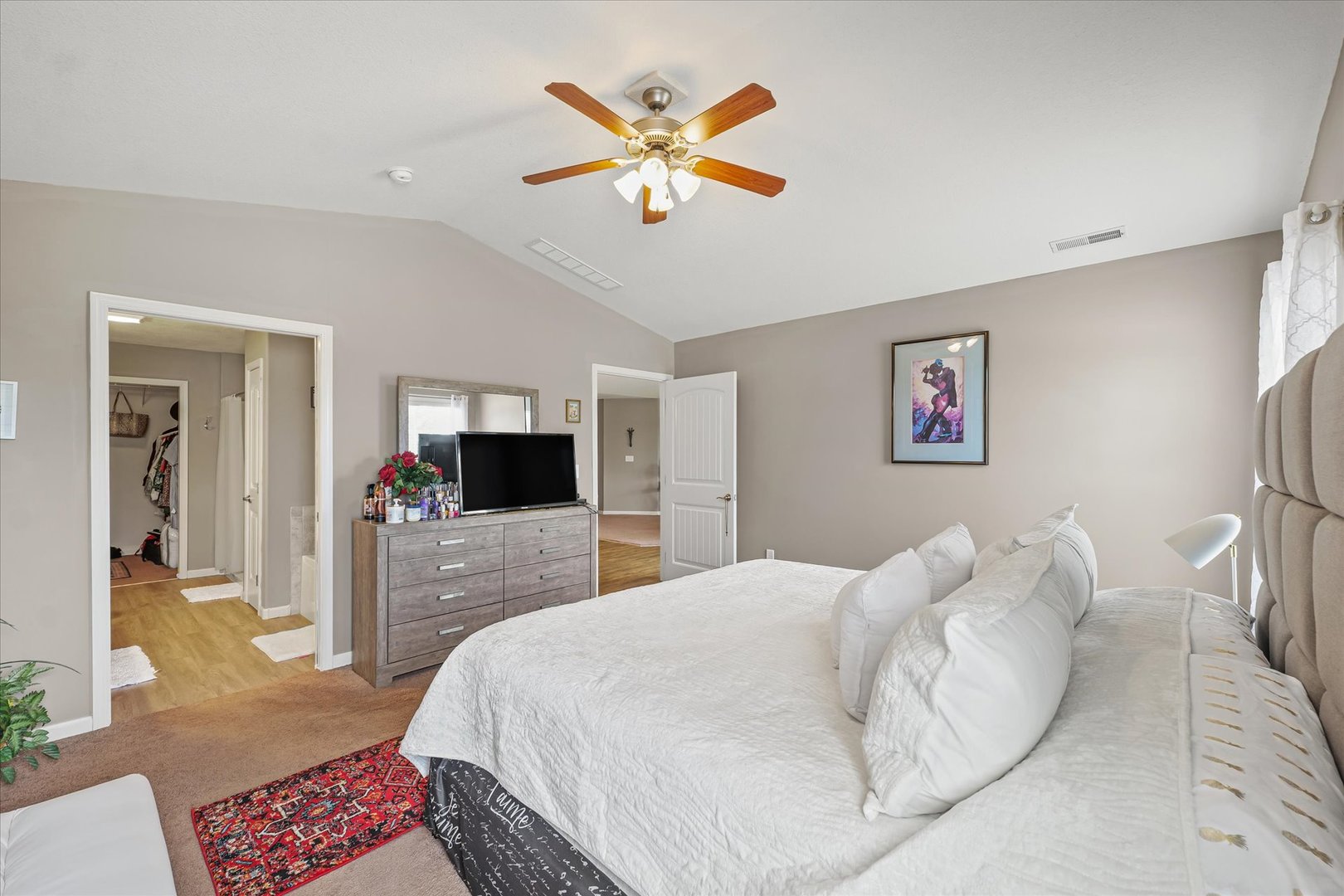 634 Sedgegrass Drive Champaign, IL 61822 - Photo 20 of 35 a bedroom with a large bed and a chandelier