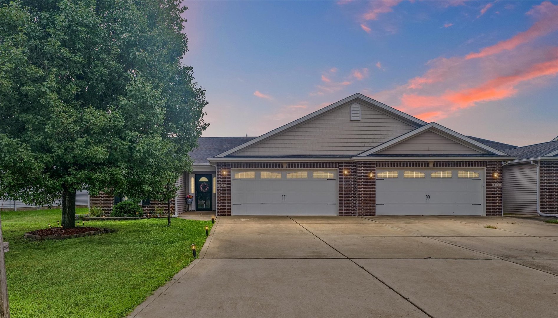 634 Sedgegrass Drive Champaign, IL 61822 - Photo 2 of 35 front view of a house with a yard and an trees