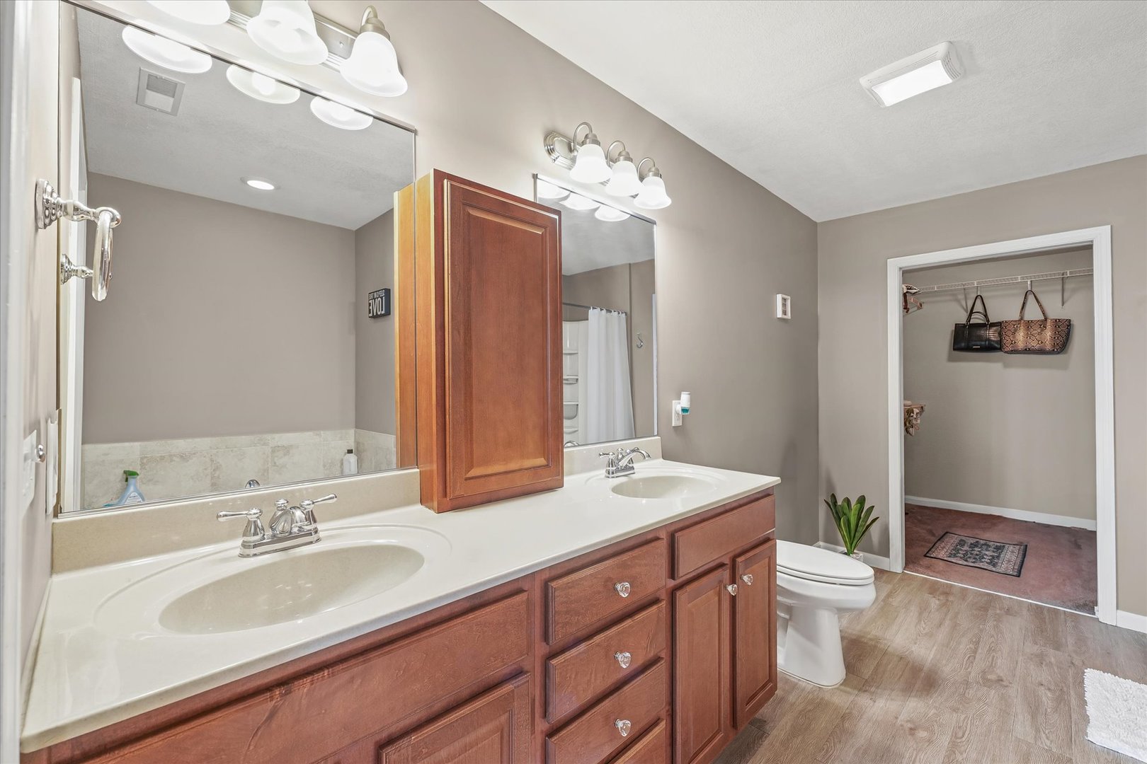 634 Sedgegrass Drive Champaign, IL 61822 - Photo 21 of 35 a spacious bathroom with a granite countertop sink a toilet a large mirror and shower