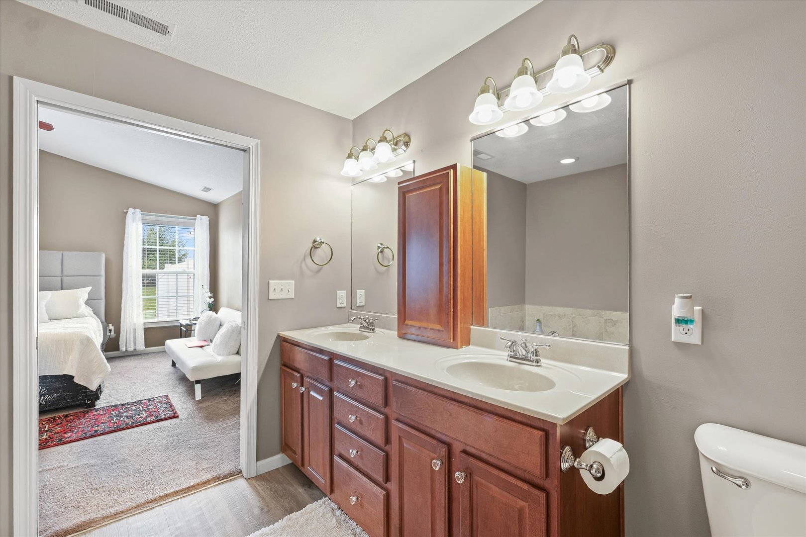 634 Sedgegrass Drive Champaign, IL 61822 - Photo 23 of 35 a spacious bathroom with a toilet a sink and a mirror
