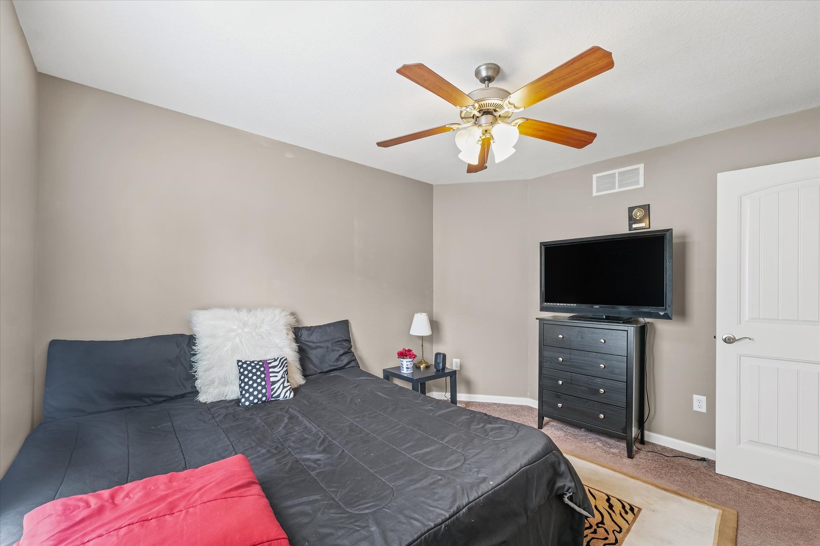 634 Sedgegrass Drive Champaign, IL 61822 - Photo 25 of 35 a living room with furniture and a flat screen tv