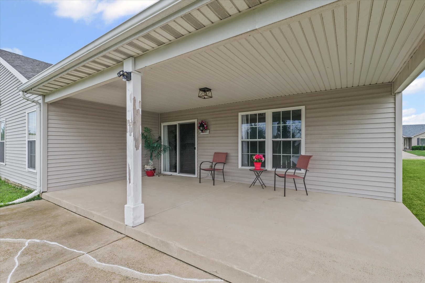 634 Sedgegrass Drive Champaign, IL 61822 - Photo 34 of 35 a view of a porch with chairs and table in a patio