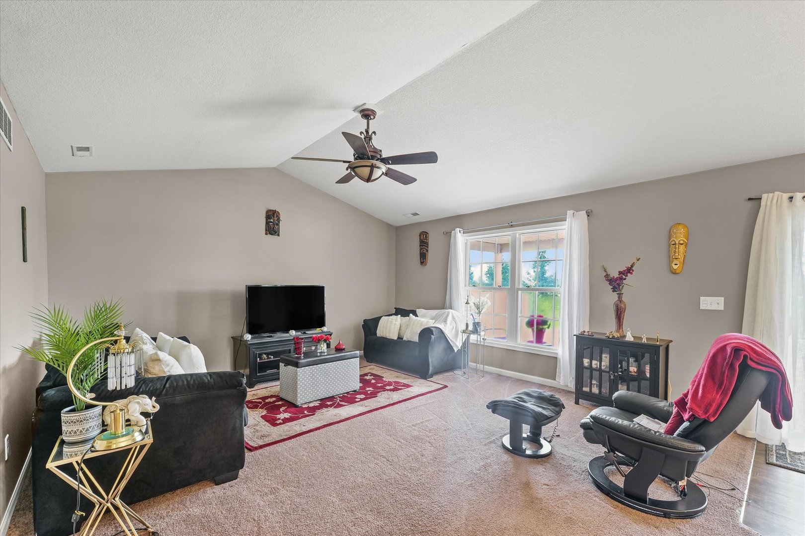 634 Sedgegrass Drive Champaign, IL 61822 - Photo 8 of 35 a living room with furniture and a flat screen tv