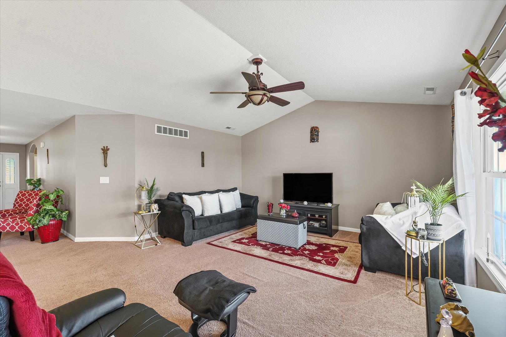 634 Sedgegrass Drive Champaign, IL 61822 - Photo 9 of 35 a living room with furniture and a flat screen tv