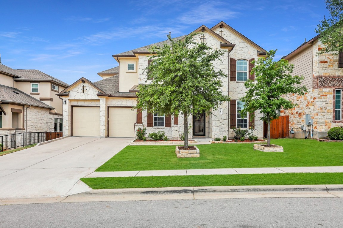 607 Dry Gulch Bend Cedar Park, TX 78613 - Photo 1 of 1 a front view of a house with a yard and garage