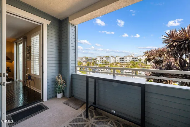a kitchen with a sink and wooden floor