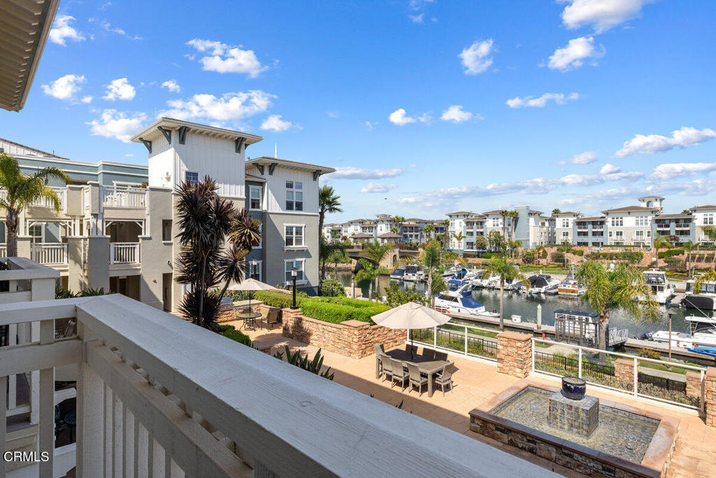 1544 Seabridge Lane Oxnard, CA 93035 - Photo 4 of 30 a view of a balcony with furniture and a potted plant