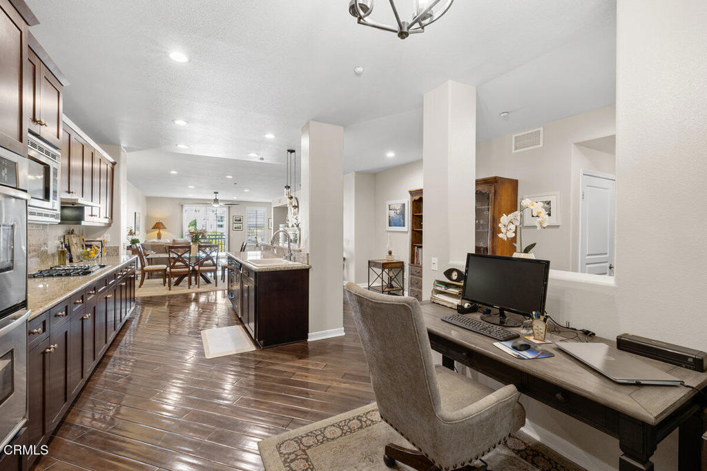 1544 Seabridge Lane Oxnard, CA 93035 - Photo 9 of 30 a kitchen with a table and chairs