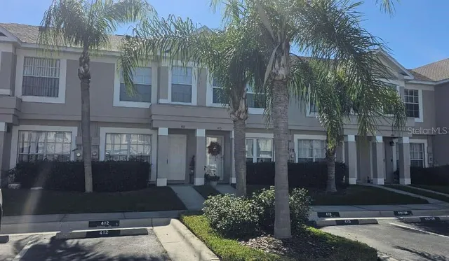 a front view of a building with garden