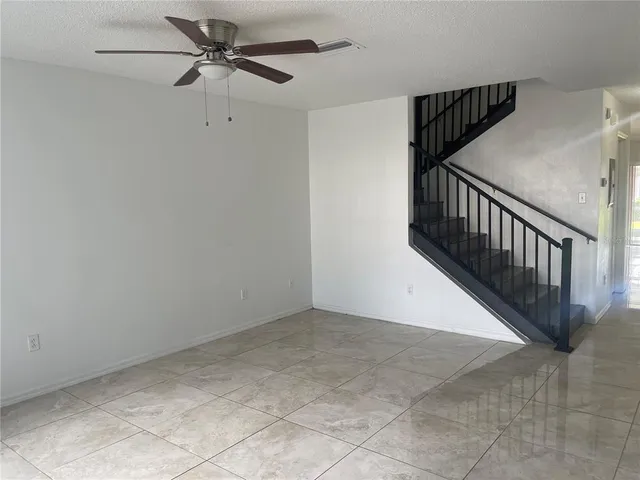 a view of a hallway with a chandelier