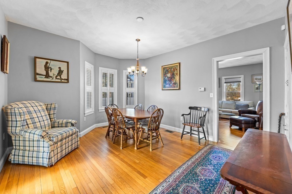 29-31 Middlesex Street, Unit 1 Chelmsford, MA 01863 - Photo 11 of 31 a view of a dining room with furniture window and wooden floor