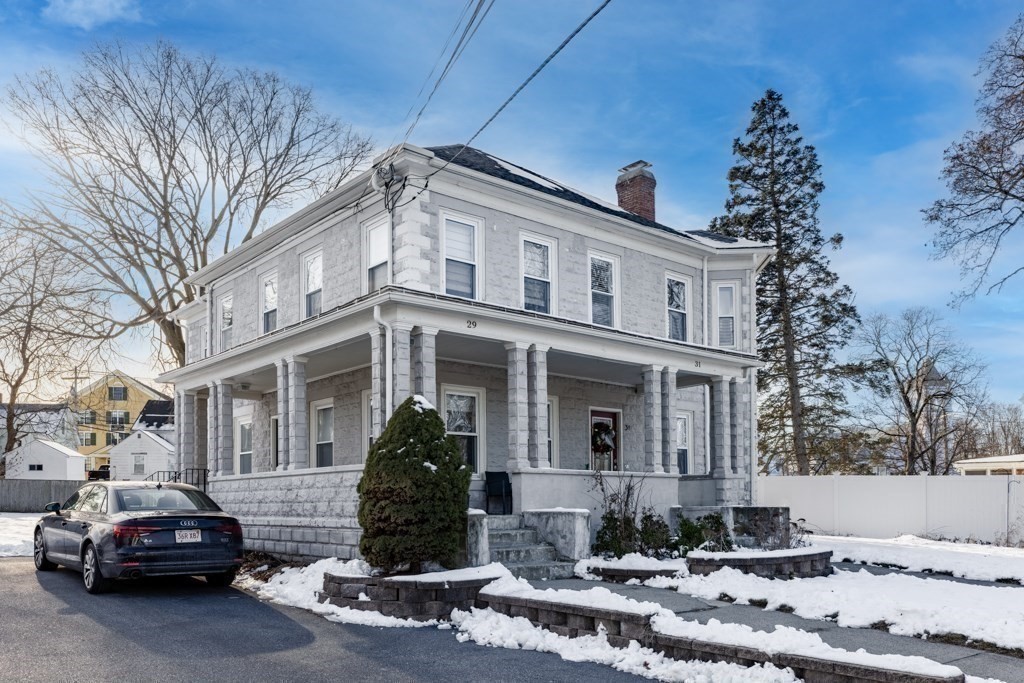 29-31 Middlesex Street, Unit 1 Chelmsford, MA 01863 - Photo 26 of 31 a front view of a house with a yard