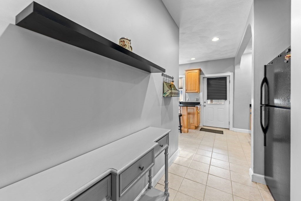 29-31 Middlesex Street, Unit 1 Chelmsford, MA 01863 - Photo 8 of 31 a kitchen with a refrigerator and microwave