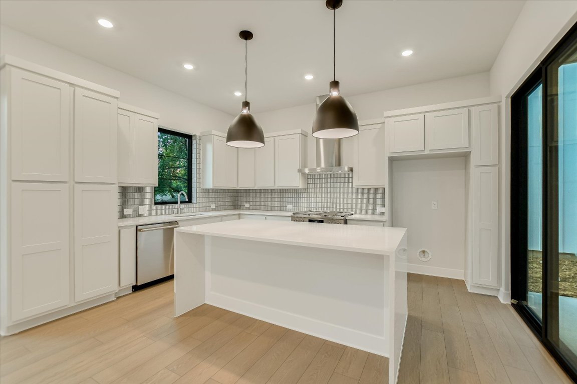 114 Lightsey Road, Unit 1 Austin, TX 78704 - Photo 11 of 25 a open kitchen with white cabinets and white appliances