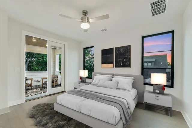 a bedroom with a large bed and a window