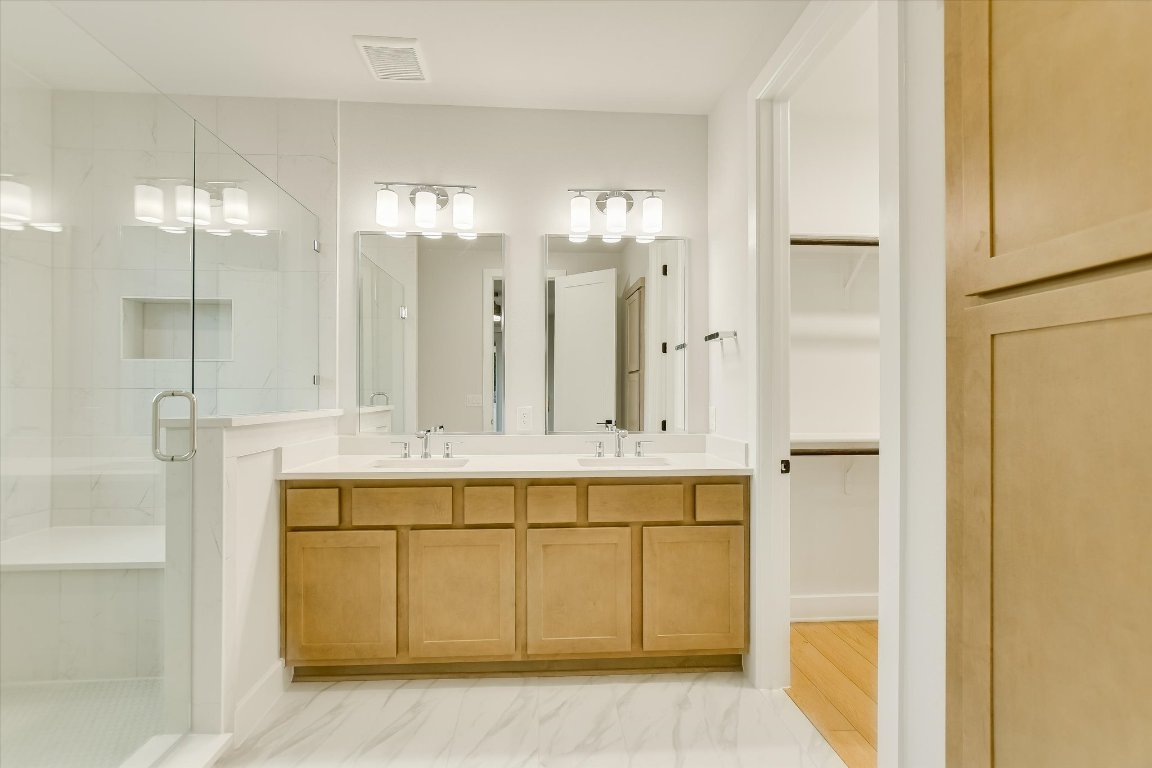 114 Lightsey Road, Unit 1 Austin, TX 78704 - Photo 20 of 25 a bathroom with a double vanity sink mirror and