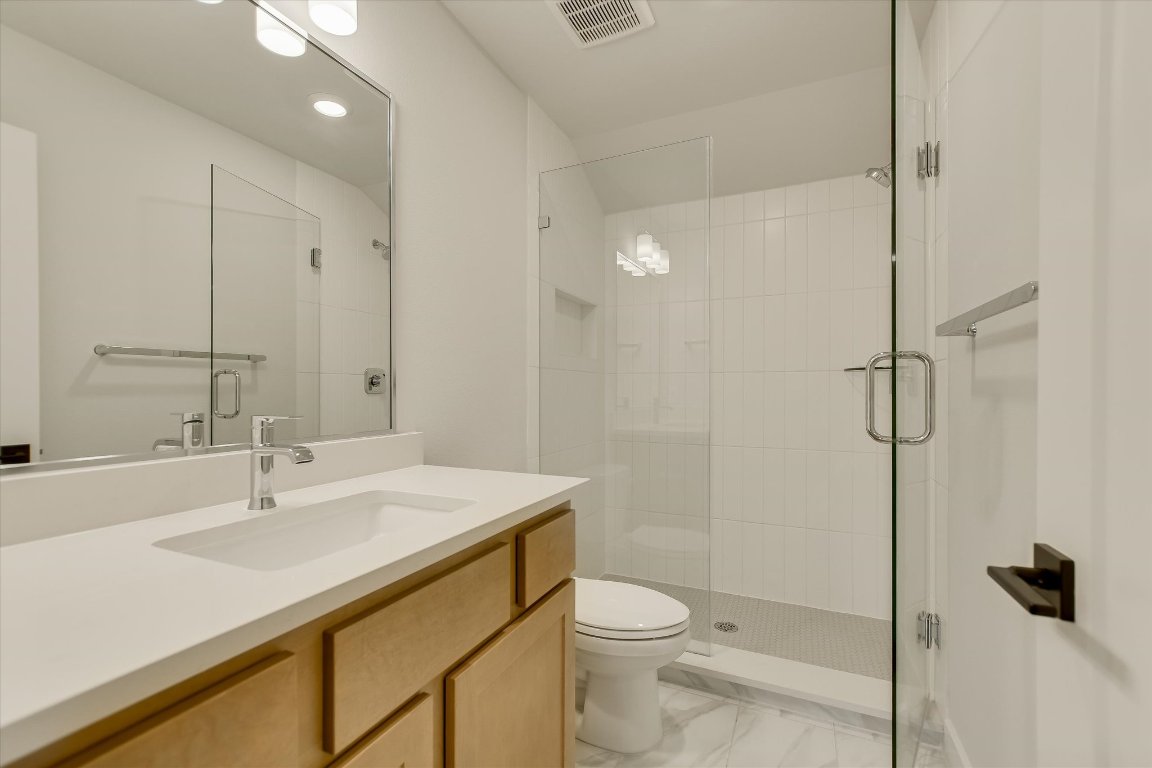 114 Lightsey Road, Unit 1 Austin, TX 78704 - Photo 22 of 25 a bathroom with a sink toilet and shower