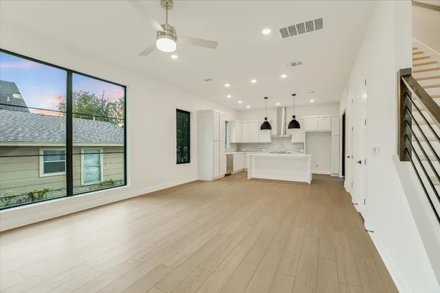 a view of an empty room with a fireplace