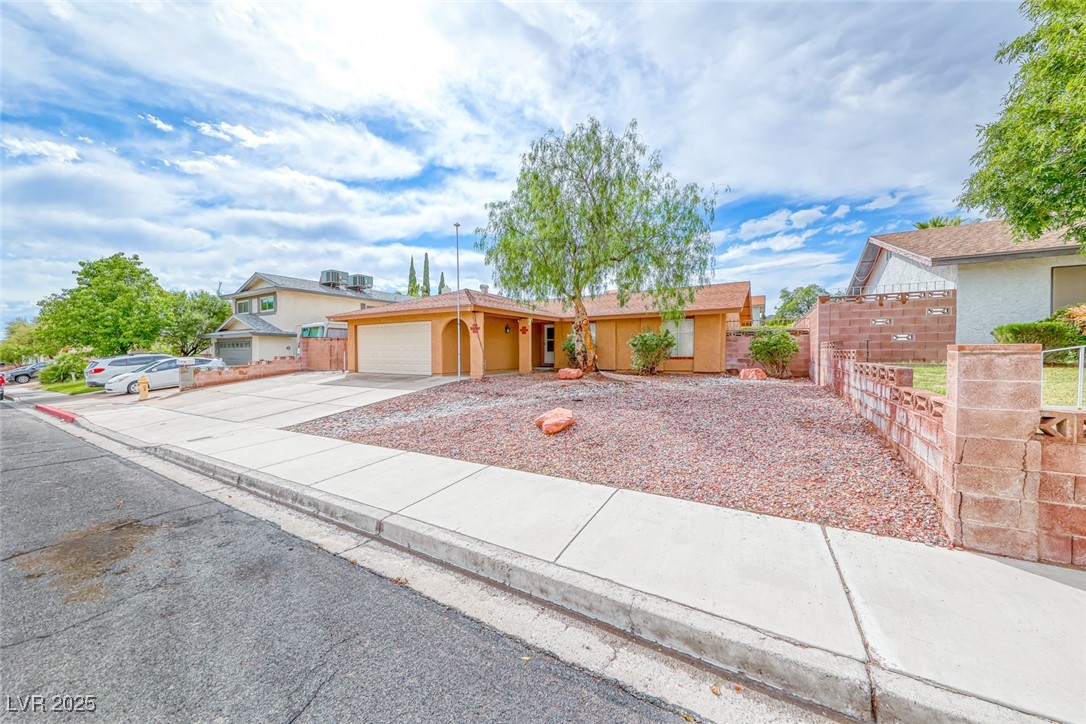 632 Arrayo Way Boulder City, NV 89005 - Photo 2 of 40 Single story home with concrete driveway, a garage, fence, and stucco siding