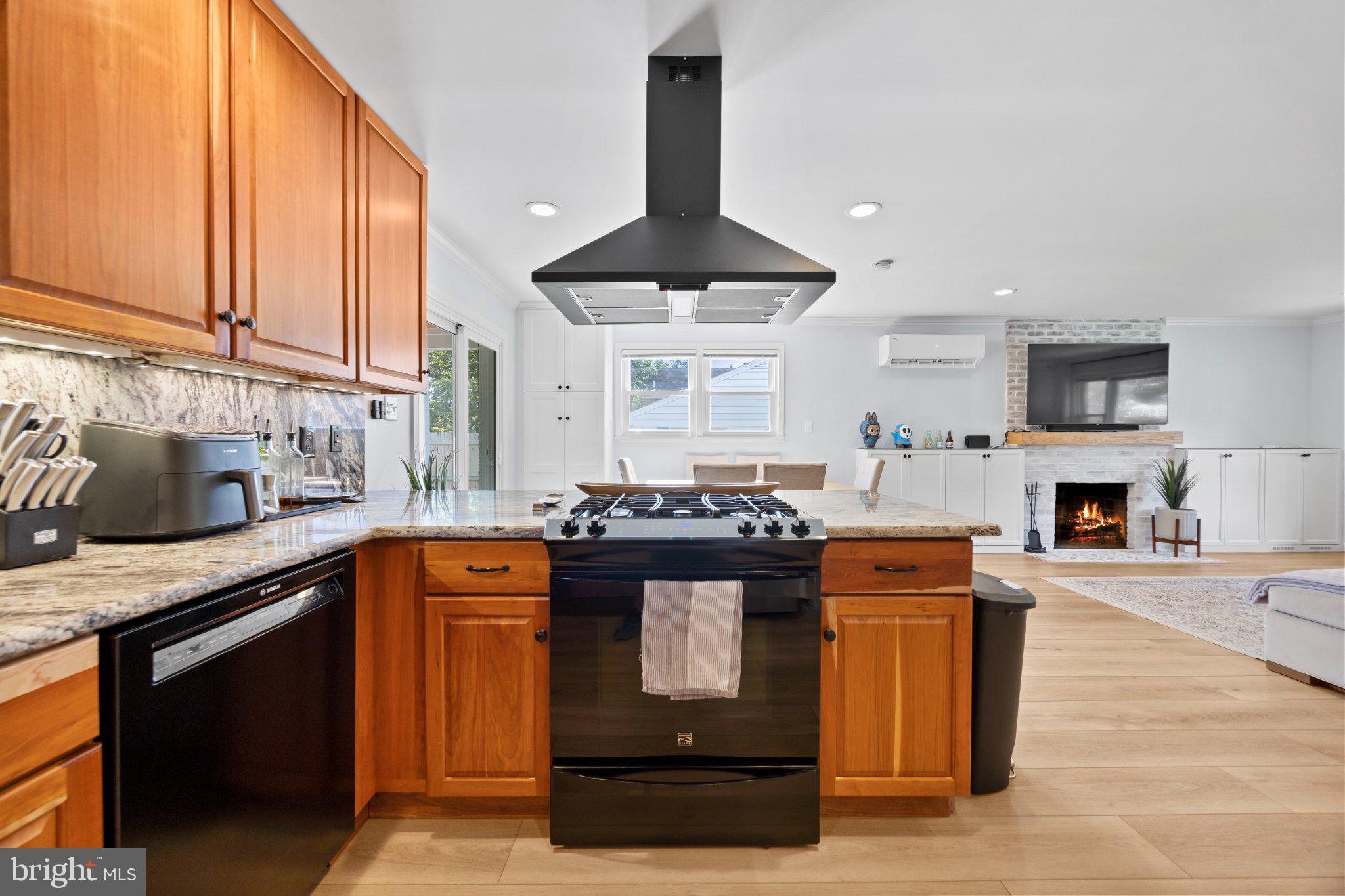 6705 New Hope Drive Springfield, VA 22151 - Photo 28 of 67 Modern kitchen with warm wood accents.