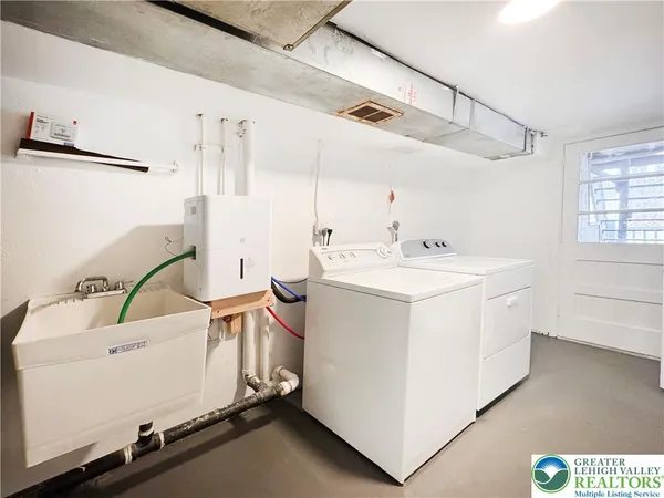 a utility room with dryer and washer