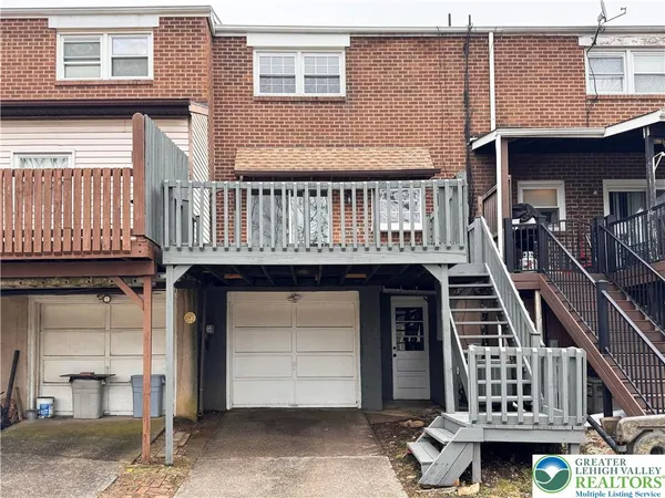 a front view of a residential apartment building with a door